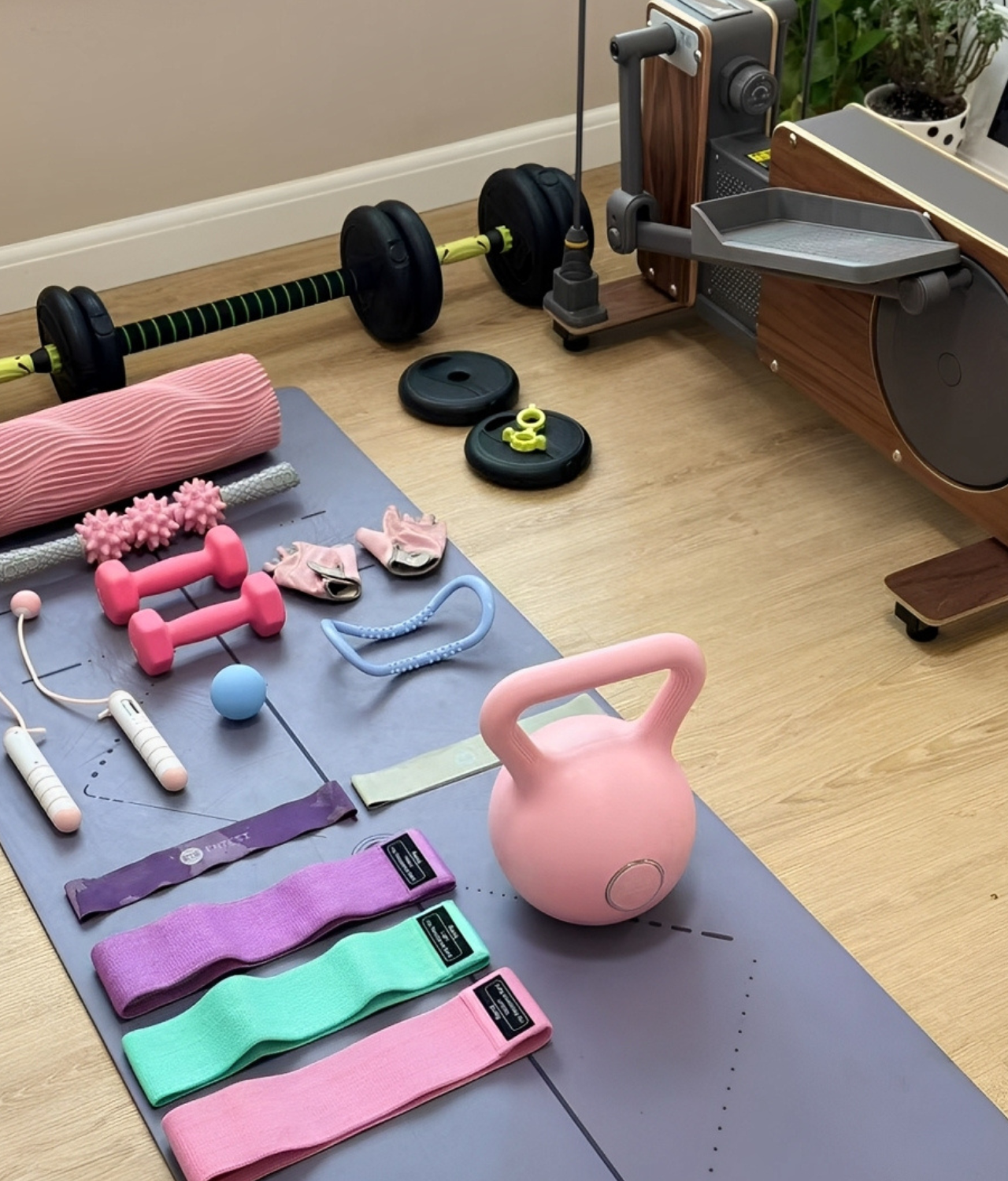 A collection of premium fitness and yoga accessories, including dumbbells, resistance bands, a kettlebell, a yoga mat, and massage tools, displayed in a modern home gym setup.