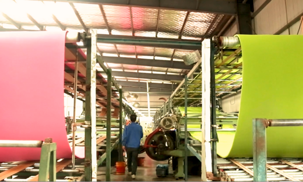 Yoga mat manufacturing facility with advanced production lines ensuring high-quality, customizable, and eco-friendly TPE and rubber mats for global B2B brands.