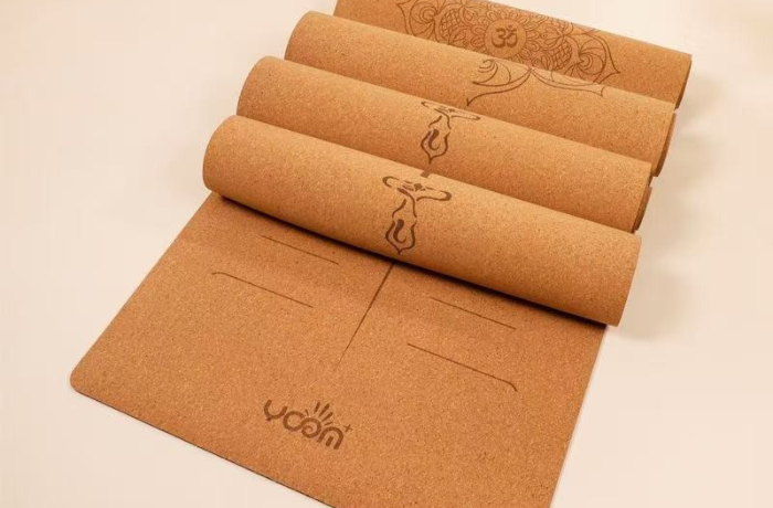 Eco-friendly cork yoga mats with engraved alignment lines, ideal for sustainable and non-slip yoga practice.