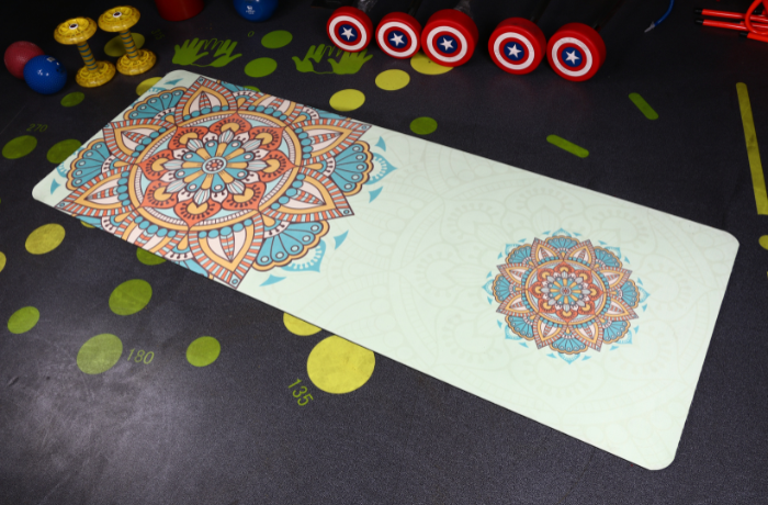 Suede yoga mat with mandala print laid out in a fitness studio, combining softness, grip, and visual appeal.