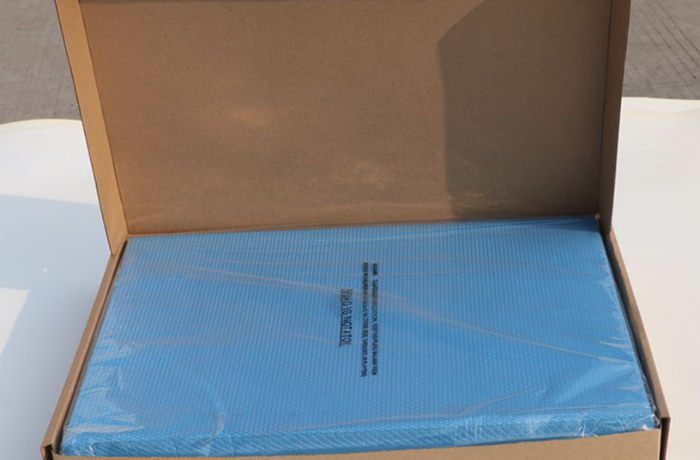 Blue balance pad packed in brown Amazon-style carton