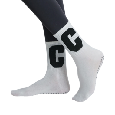 White non-slip yoga socks with bold CG letters and grip dots