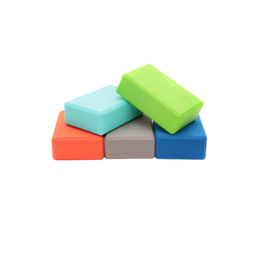 Stack of five colored EVA foam yoga blocks for support and stability