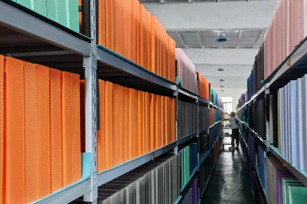 Shelves stocked with colorful balance pads in warehouse