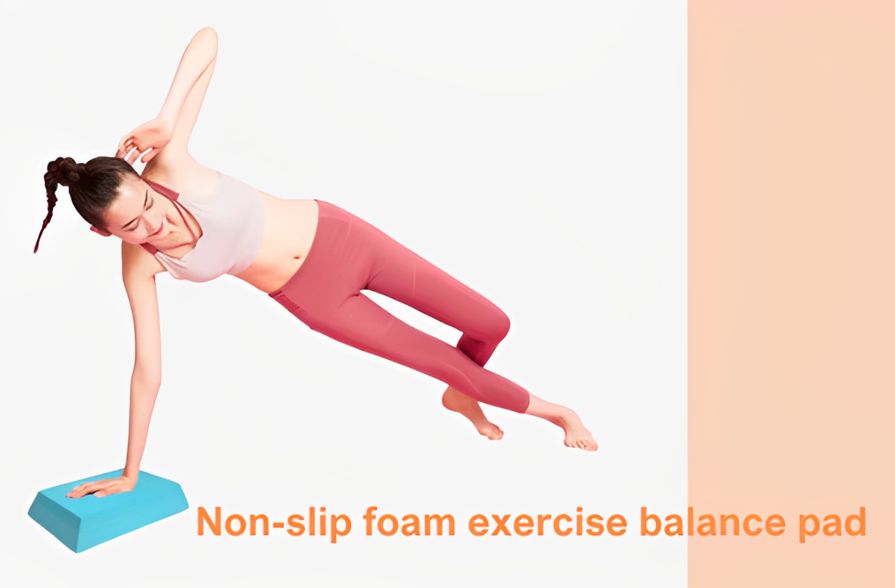 Woman performing side plank on blue non-slip foam balance pad