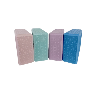 Textured yoga blocks in pink, mint, lavender, and blue for extra grip