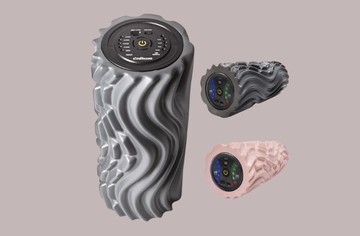 Three high-tech vibrating foam rollers with wave-like textures in gray, black, and pink.