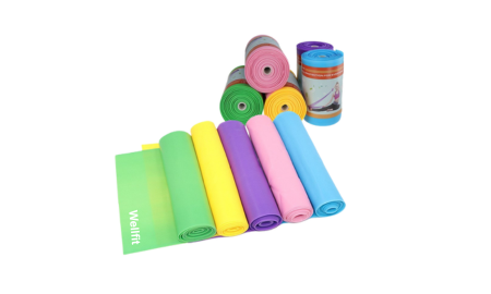 A set of colorful resistance bands in various pastel colors arranged neatly, featuring the "Wellfit" brand.
