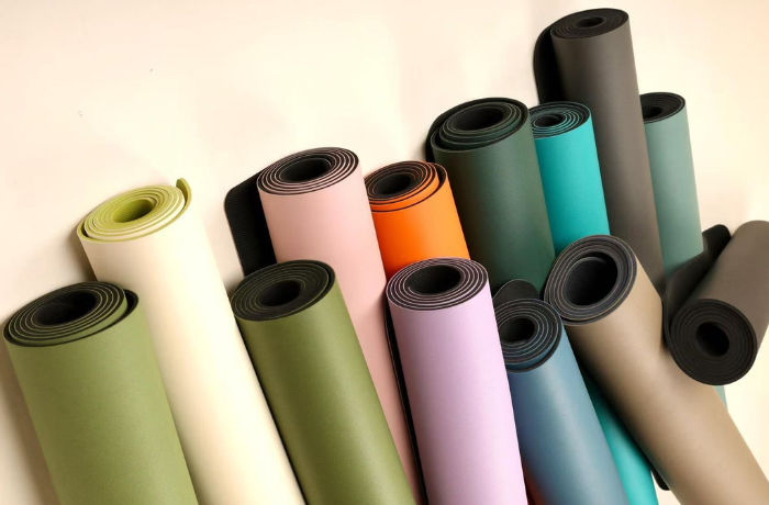 2025 USA yoga mat color lineup—neutrals, pastels, accent orange display

