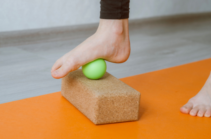 Arch massage using smooth ball and yoga block