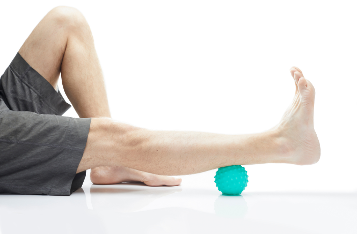 Seated leg massage using textured massage ball
