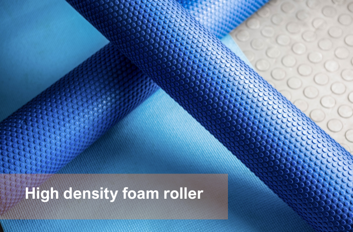 Textured blue high density foam roller on yoga mat for wholesale use