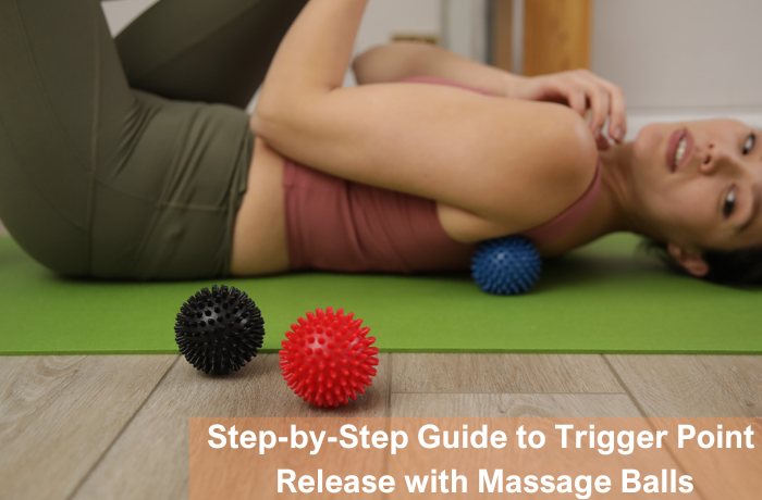 Woman using trigger point massage ball for muscle release on mat