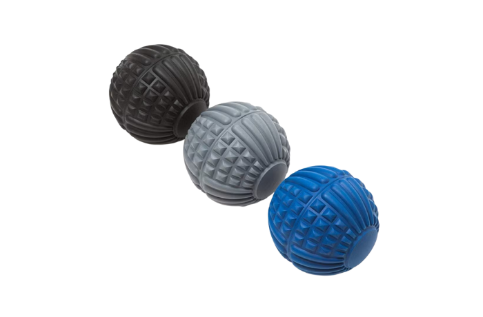 Textured massage balls in black, grey, and blue for deep tissue therapy