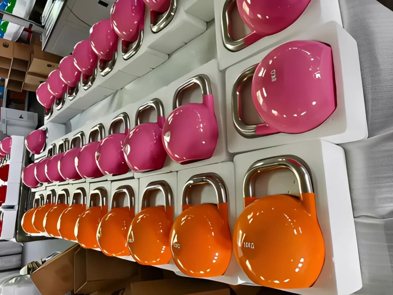 Wholesale colorful kettlebells with stainless steel handles for gyms and fitness brands